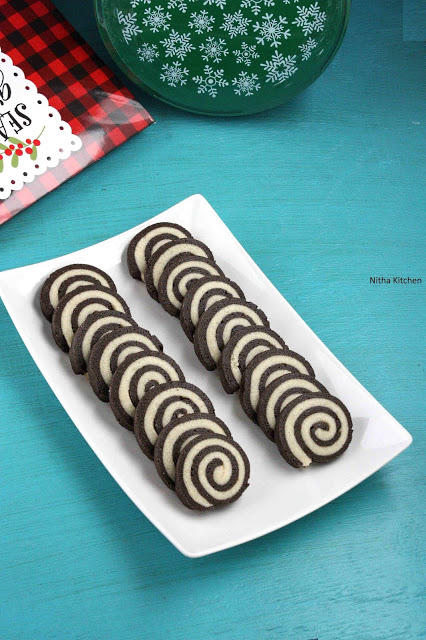 pinwheel cookies, vanilla pinwheel cookies, vanilla chocolate pinwheel cookies recipe, pinwheel cookies recipe, eggless pinwheel cookies, easy christmas cookies recipe