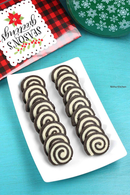 pinwheel cookies, vanilla pinwheel cookies, vanilla chocolate pinwheel cookies recipe, pinwheel cookies recipe, eggless pinwheel cookies, easy christmas cookies recipe