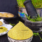 Ponnanganni Keerai Idli Podi and healthy homegrown microgreens at backdrop